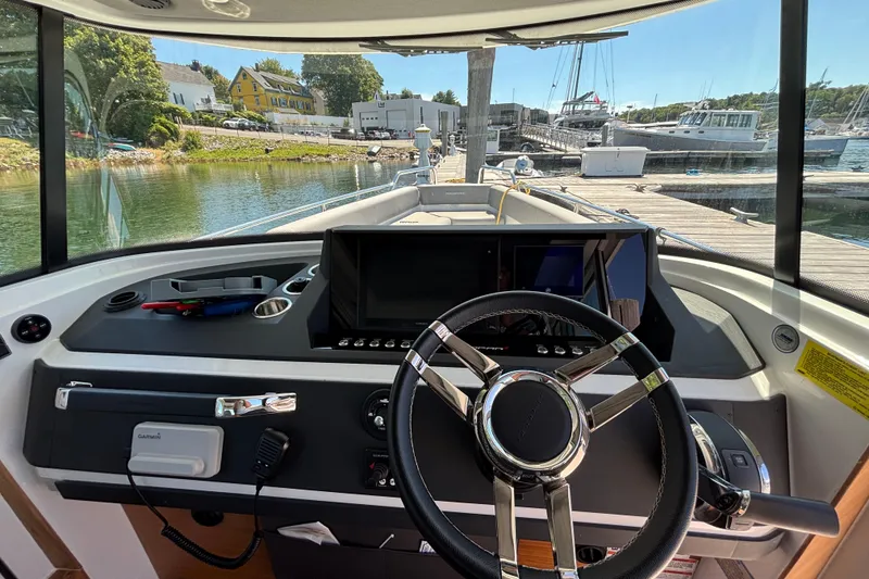Slide: The Image of Interior view of 2020 Axopar 28 Cabin Aft Cabin boat at marina dock. - 16