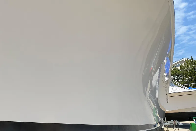 Slide: The Image of Close-up of 1992 Luhrs Tournament 320 Convertible boat hull with reflection. - 17