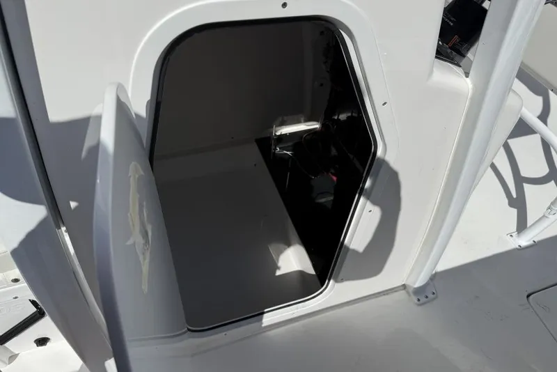Slide: The Image of Open storage compartment on Delta D245 boat, 2026 model, with visible interior space. - 9
