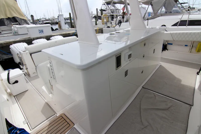 Slide: The Image of 2023 Regal 38 SAV boat interior with sleek white cabinetry and modern design. - 19