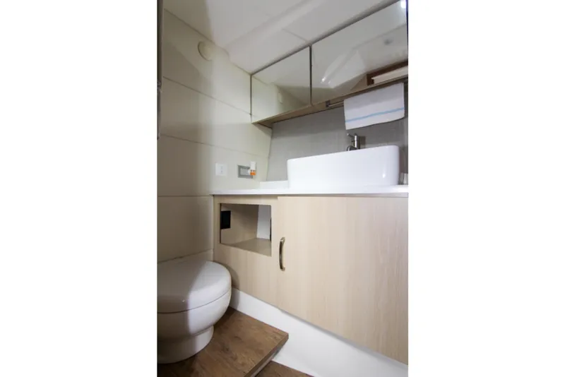Slide: The Image of 2023 Regal 38 SAV yacht bathroom with modern sink and wooden cabinetry. - 26
