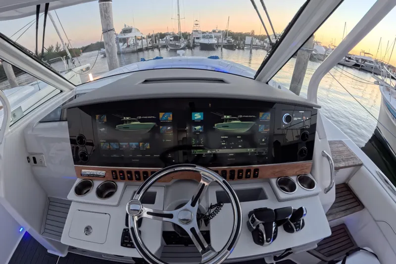 Slide: The Image of Cockpit view of 2023 Regal 38 SAV boat with advanced navigation system. - 37