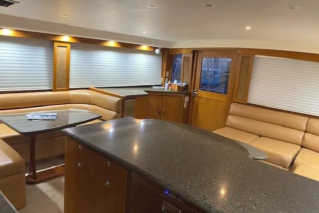 Slide: The Image of Luxurious interior of 1989 Buddy Davis 61 Sportfish yacht with leather seating and modern finishes. - 12