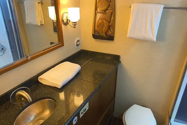 Slide: The Image of Luxurious bathroom in 1989 Buddy Davis 61 Sportfish yacht with elegant fixtures and decor. - 20