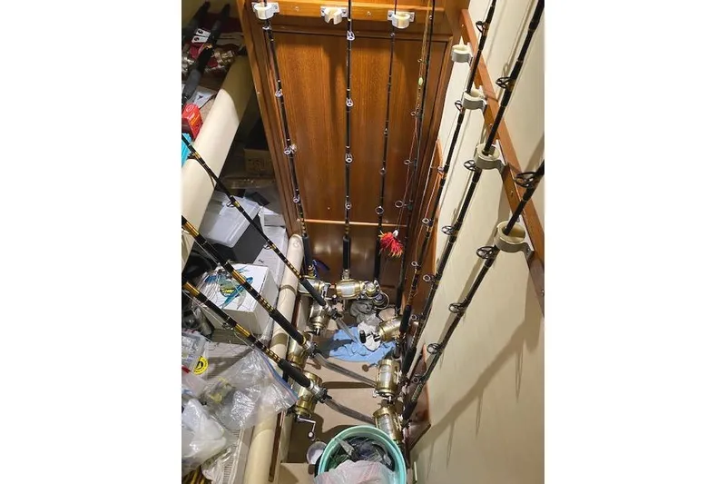 Slide: The Image of Fishing rods stored in a 1989 Buddy Davis 61 Sportfish boat interior. - 22