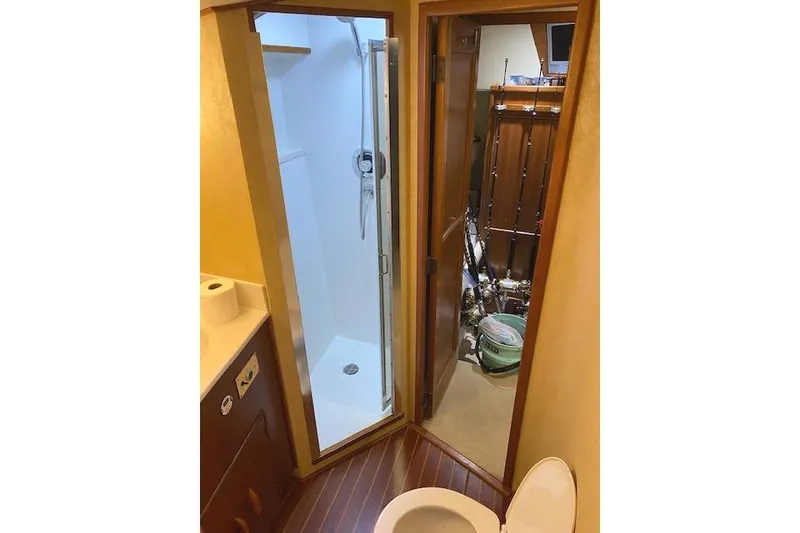 Slide: The Image of Bathroom and shower area on a 1989 Buddy Davis 61 Sportfish yacht. - 26