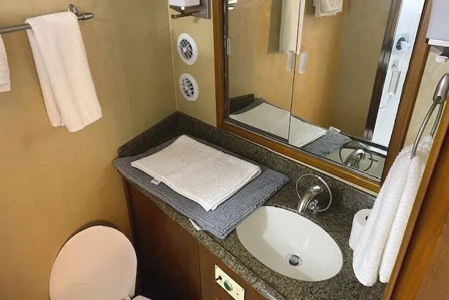 Slide: The Image of Bathroom interior of 1989 Buddy Davis 61 Sportfish yacht with sink and mirror. - 28