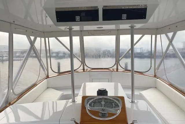 Slide: The Image of 1989 Buddy Davis 61 Sportfish helm with panoramic marina view. - 36