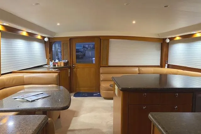 Slide: The Image of Interior of 1989 Buddy Davis 61 Sportfish yacht with elegant wood and leather furnishings. - 7