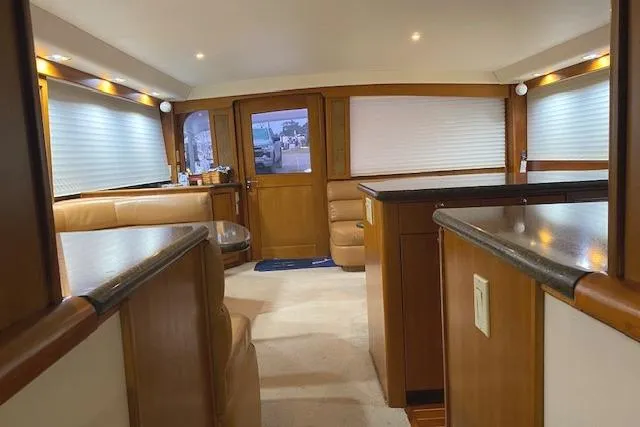 Slide: The Image of Interior of 1989 Buddy Davis 61 Sportfish yacht with wood accents and seating. - 8
