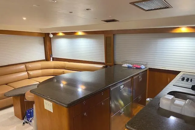 Slide: The Image of Luxurious interior of 1989 Buddy Davis 61 Sportfish yacht with modern kitchen and seating area. - 9
