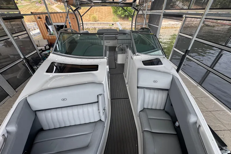 Slide: The Image of 2022 Cobalt R35 boat interior with sleek gray seating and modern design. - 15