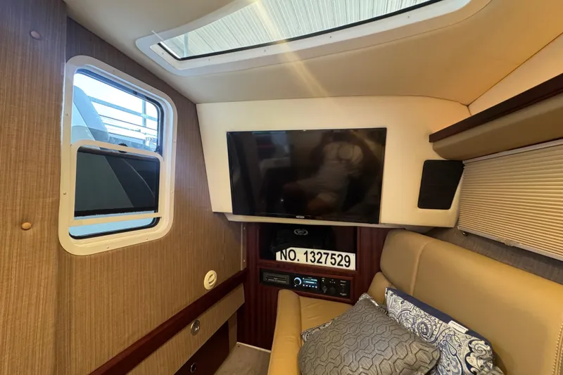 Slide: The Image of Luxurious interior of a 2022 Cobalt R35 boat with TV and comfortable seating. - 18