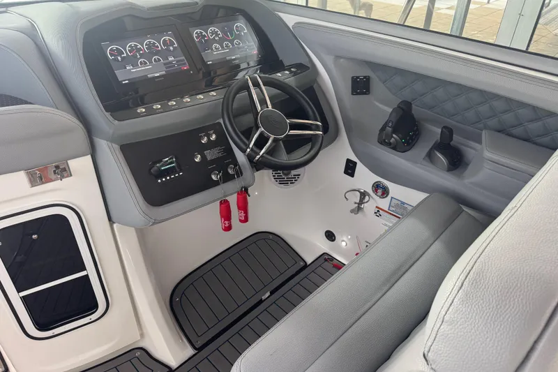 Slide: The Image of 2022 Cobalt R35 boat cockpit with modern dashboard and steering wheel. - 5
