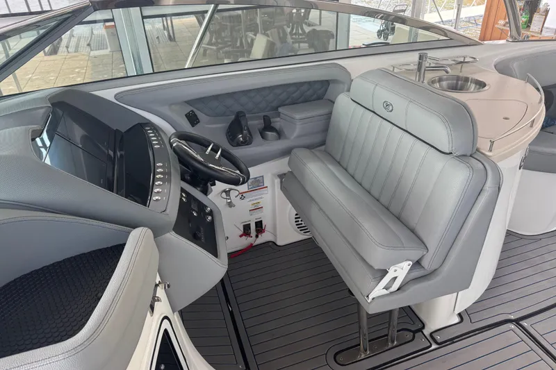 Slide: The Image of 2022 Cobalt R35 boat interior with sleek helm, modern controls, and comfortable seating. - 6