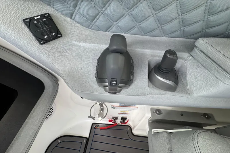 Slide: The Image of 2022 Cobalt R35 boat control panel with joystick and throttle levers. - 7