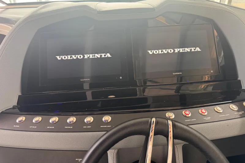 Slide: The Image of 2022 Cobalt R35 dashboard with dual Garmin displays and Volvo Penta branding. - 8