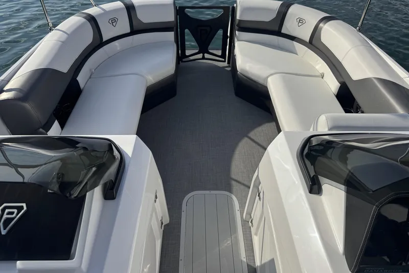 Slide: The Image of 2026 Paradigm Boats 27SST interior with sleek seating and modern design on the water. - 10
