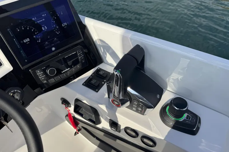 Slide: The Image of Control panel of 2026 Paradigm Boats 27SST with advanced navigation system. - 15