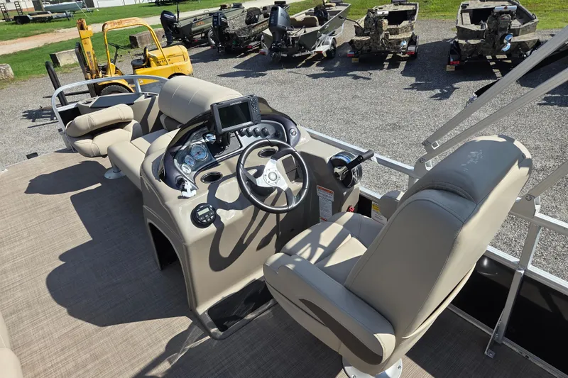 Slide: The Image of 2021 Sun Tracker Fishin' Barge 20 DLX interior with steering console and seating. - 12