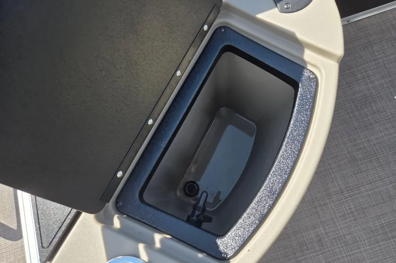 Slide: The Image of Open storage compartment on 2021 Sun Tracker Fishin' Barge 20 DLX boat. - 13