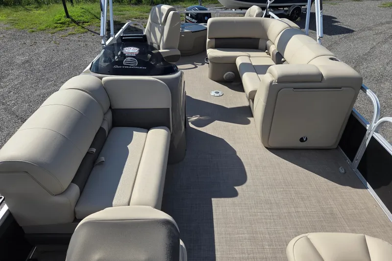 Slide: The Image of 2021 Sun Tracker Fishin' Barge 20 DLX interior with beige seating and spacious layout. - 15