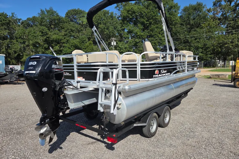 Slide: The Image of 2021 Sun Tracker Fishin' Barge 20 DLX pontoon boat with Mercury 90 engine on trailer. - 4