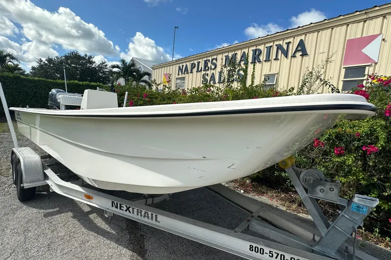 Slide: The Image of 2024 Carolina Skiff E24 DLX CC boat on trailer at Naples Marina Sales. - 3