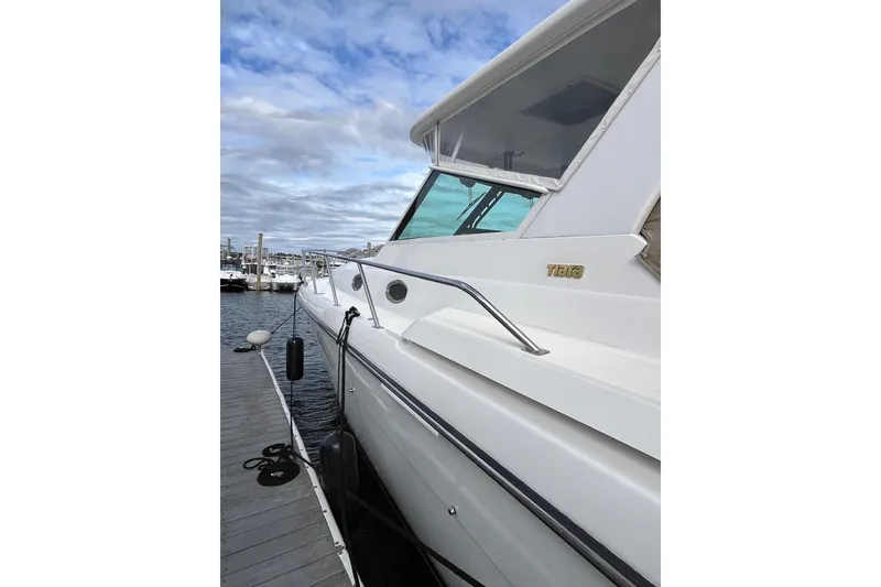 Slide: The Image of 1999 Tiara Yachts 4000 Express docked, showcasing sleek design and modern features. - 10