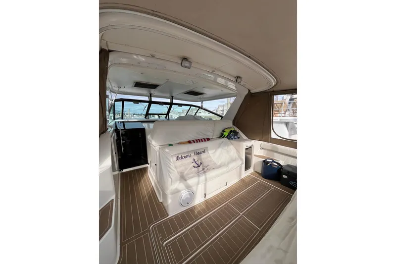 Slide: The Image of Interior of 1999 Tiara Yachts 4000 Express, featuring spacious seating and elegant design. - 14