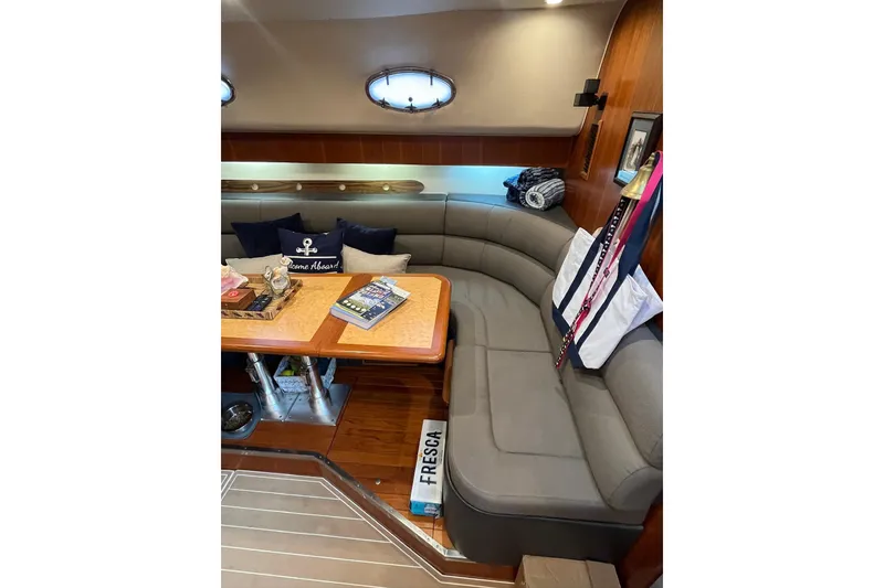 Slide: The Image of Luxurious interior of 1999 Tiara Yachts 4000 Express with cozy seating and nautical decor. - 31