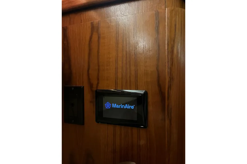 Slide: The Image of MarinAire control panel on 1999 Tiara Yachts 4000 Express wooden interior. - 40