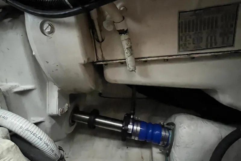 Slide: The Image of Engine compartment of a 1999 Tiara Yachts 4000 Express, showcasing mechanical components. - 48