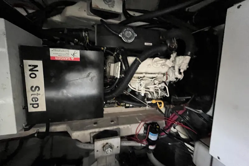 Slide: The Image of Engine compartment of a 1999 Tiara Yachts 4000 Express with "No Step" warning sign. - 50