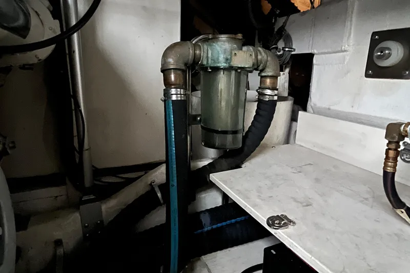 Slide: The Image of Engine room of 1999 Tiara Yachts 4000 Express showing plumbing and mechanical components. - 54