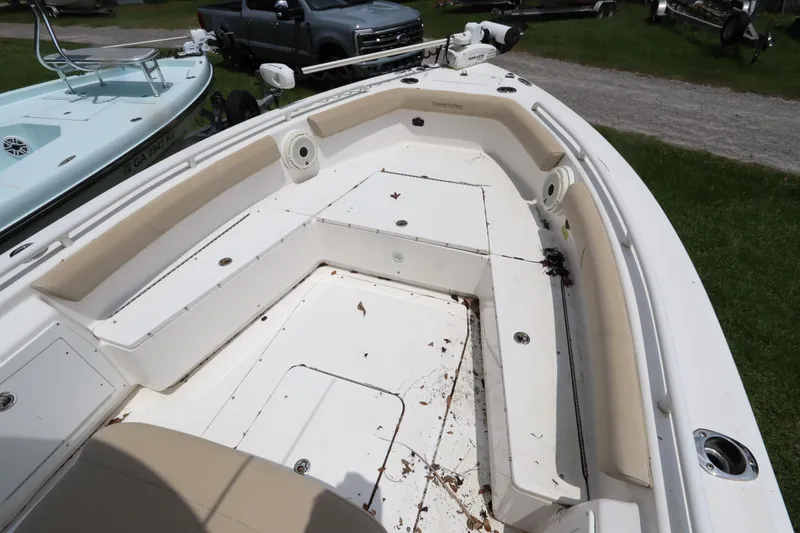 Slide: The Image of 2020 Everglades 243 Center Console boat interior with seating and storage compartments. - 10
