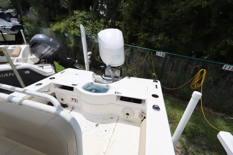 Slide: The Image of 2020 Everglades 243 Center Console boat with Yamaha outboard motor, docked outdoors. - 16