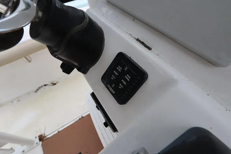 Slide: The Image of 2020 Everglades 243 Center Console boat dashboard with control panel and steering wheel. - 19