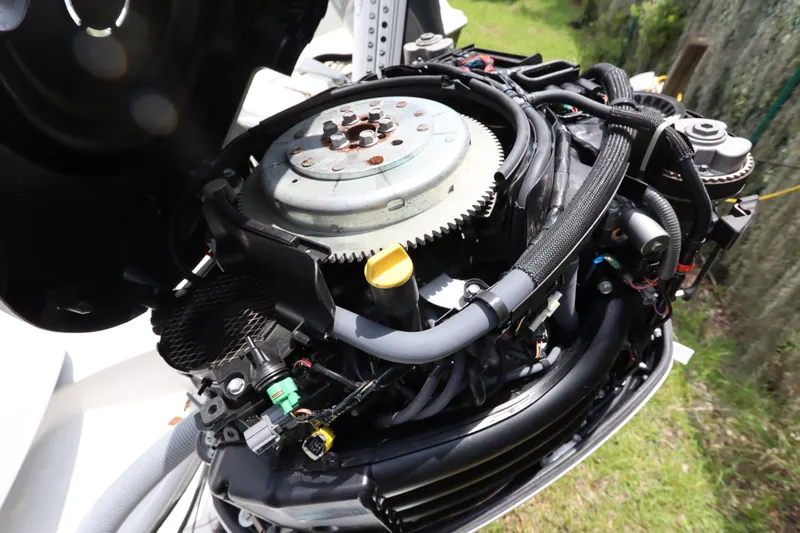 Slide: The Image of 2020 Everglades 243 Center Console engine close-up, showcasing intricate mechanical components. - 22