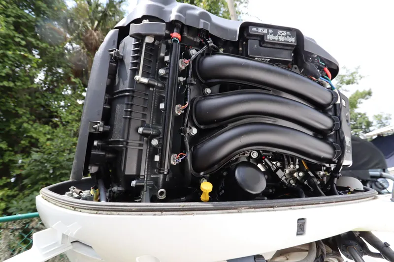 Slide: The Image of 2020 Everglades 243 Center Console boat engine, detailed view of components. - 23