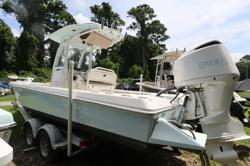 Slide: The Image of 2020 Everglades 243 Center Console boat with Yamaha engine, parked on a trailer. - 4