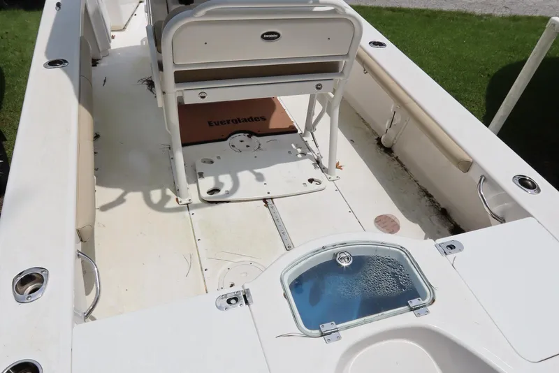 Slide: The Image of 2020 Everglades 243 Center Console boat interior with seating and storage compartments. - 7