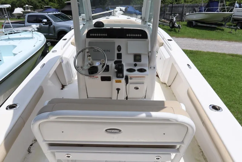 Slide: The Image of 2020 Everglades 243 Center Console boat interior with steering wheel and control panel. - 8