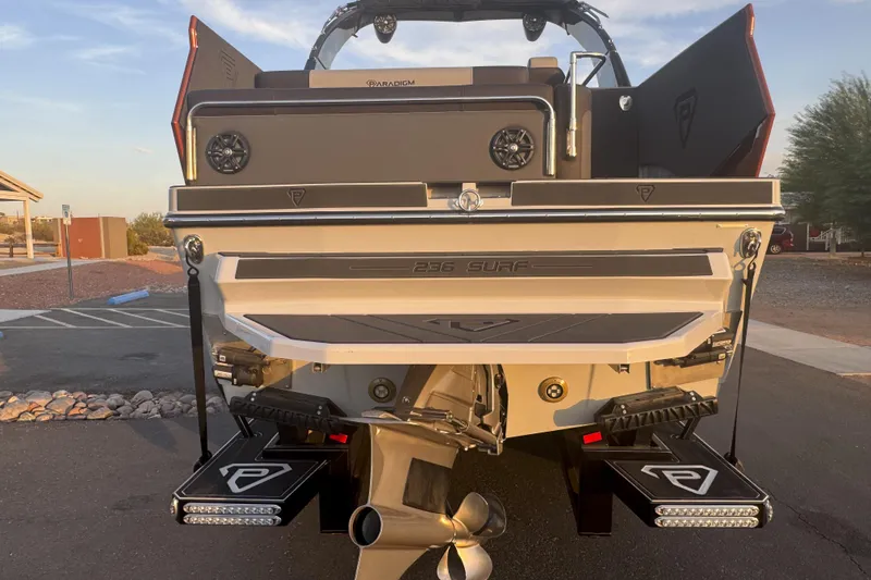 Slide: The Image of 2026 Paradigm 236 Surf boat rear view with propeller and platform details. - 4