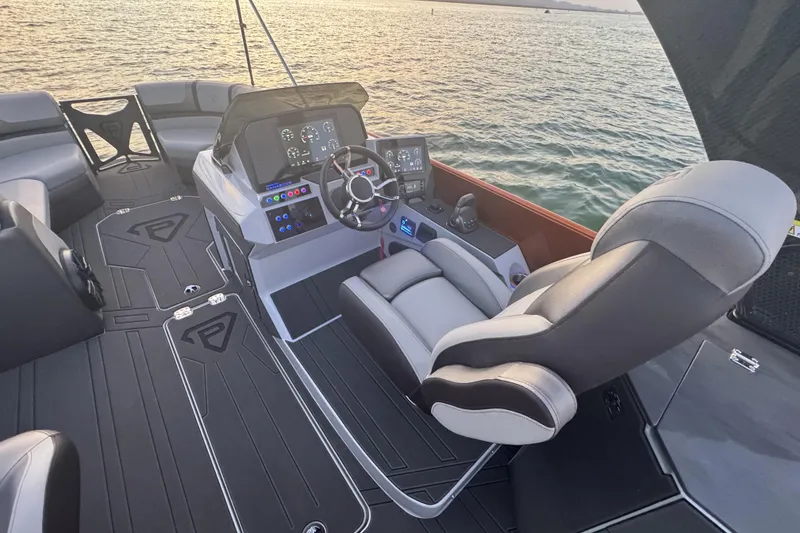 Slide: The Image of Luxurious interior of 2026 Paradigm 236 Surf boat with modern dashboard and seating. - 5