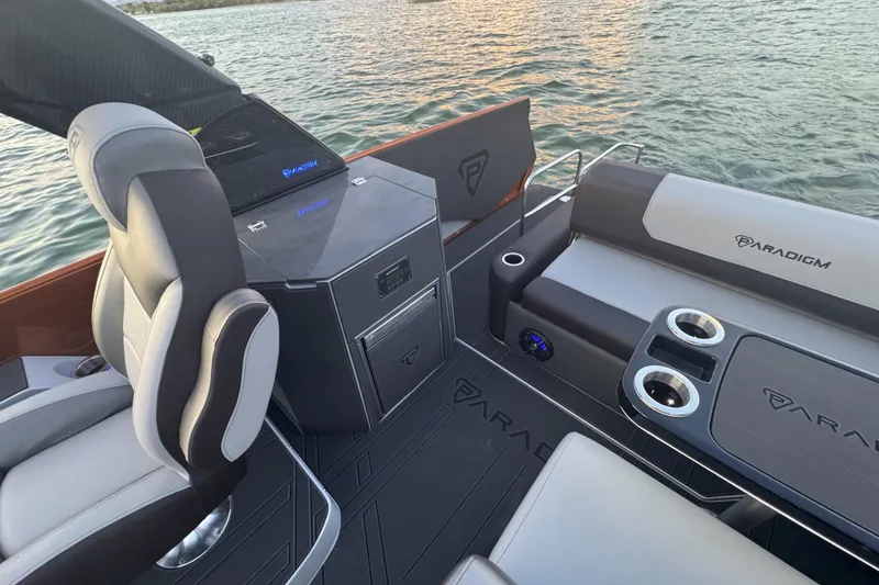 Slide: The Image of Interior of 2026 Paradigm 236 Surf boat with modern seating and storage. - 7