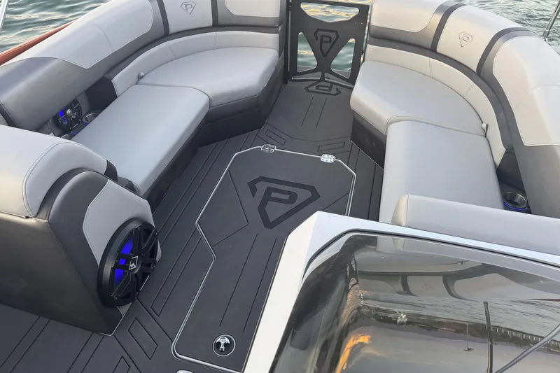 Slide: The Image of 2026 Paradigm 236 Surf boat interior with sleek seating and modern design. - 9