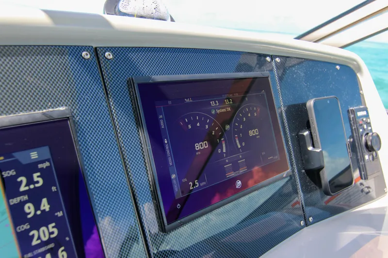 Slide: The Image of Dashboard of 2008 Formula 400 Super Sport boat with digital displays and controls. - 16