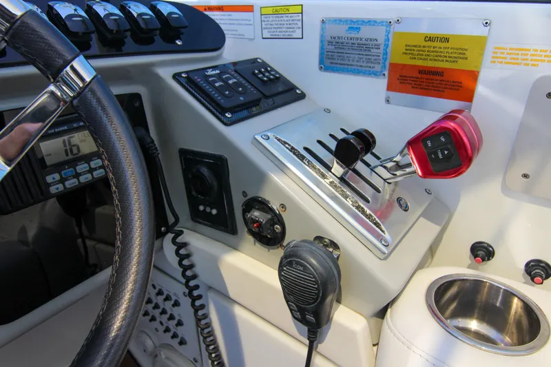Slide: The Image of 2008 Formula 400 Super Sport boat dashboard with controls and steering wheel. - 17