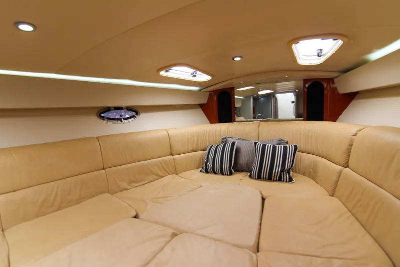 Slide: The Image of Luxurious interior of 2008 Formula 400 Super Sport yacht with beige seating and striped pillows. - 20